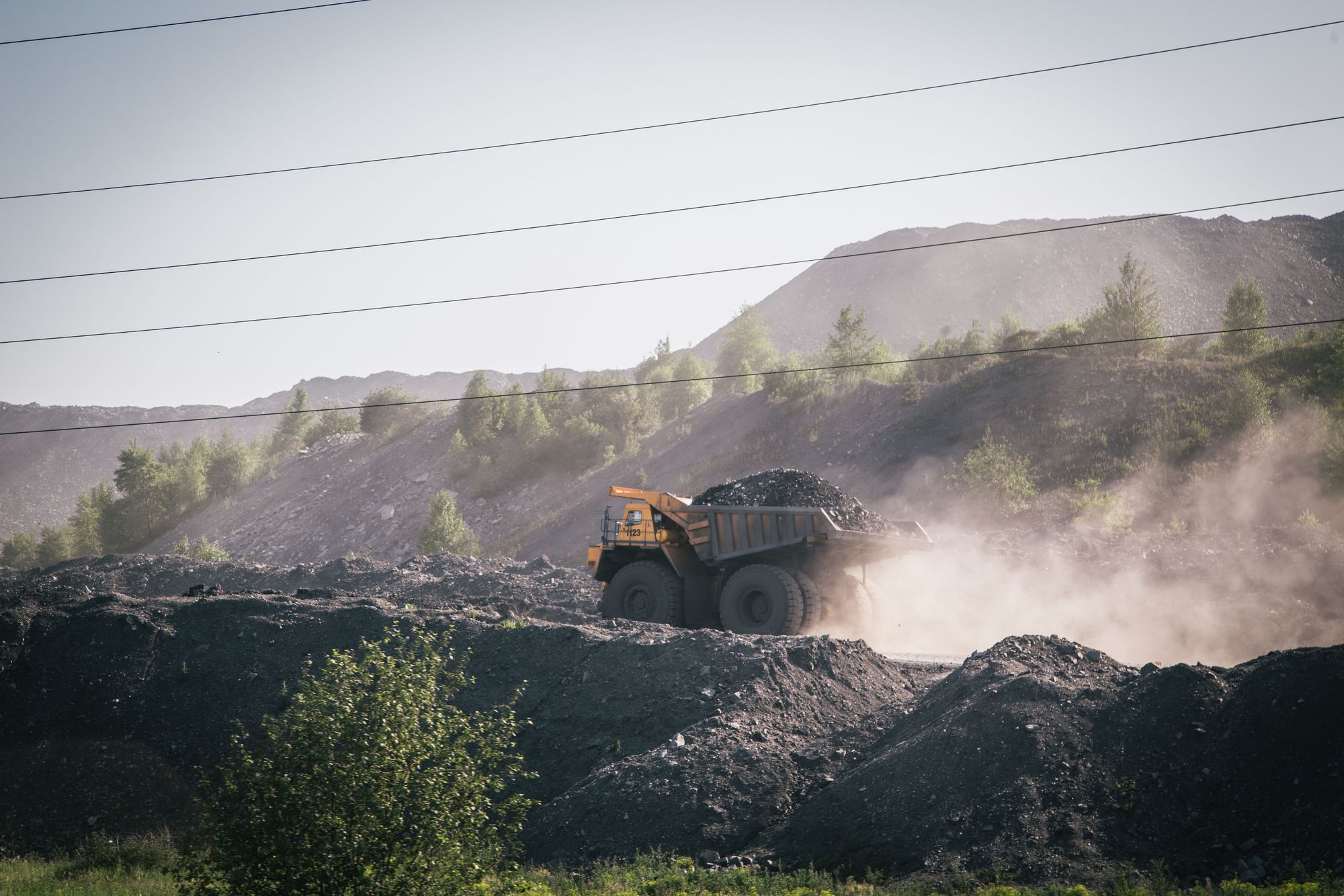Haul truck carrying ore along a mine haul road
